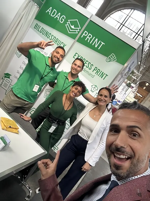 Onspire Nation team at ADAG Print booth during Swiss education and business networking event
