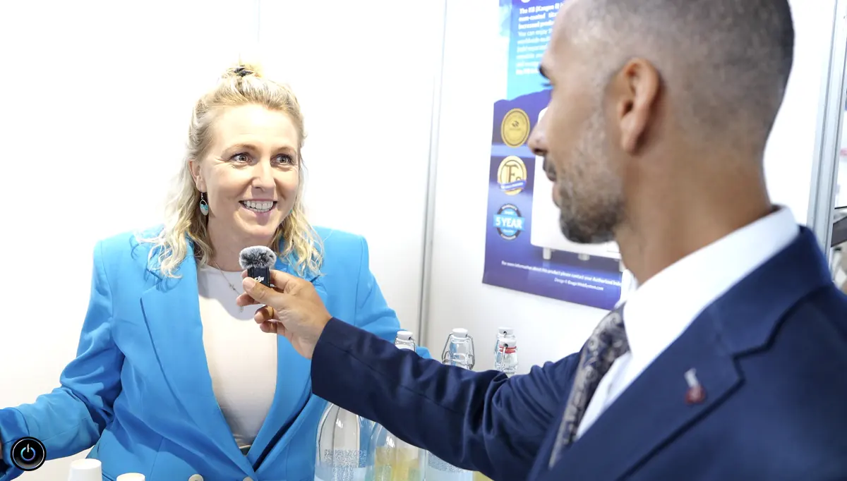 Birol Isik interviewing business woman in blue blazer about AI consulting and digital transformation strategies
