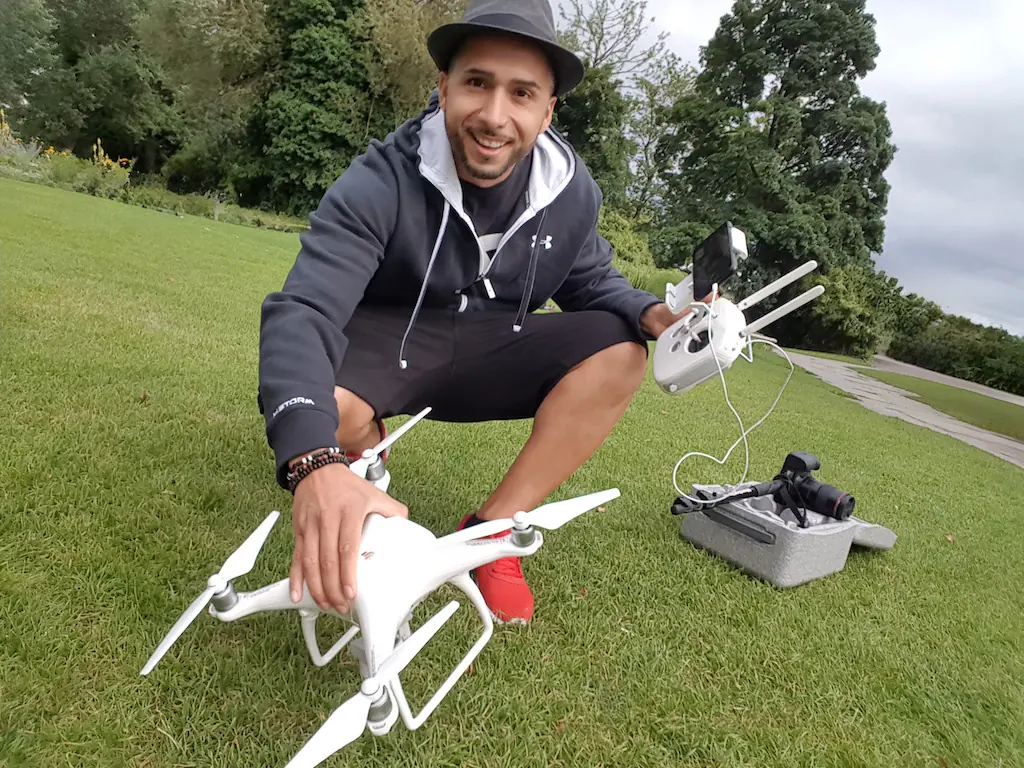 Birol Isik operating professional drone for aerial content creation and video production outdoors